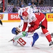 COLOGNE, GERMANY - MAY 15: Denmark\s Peter Regin #93 takes down Italy's Raphael Andergassen #19 during preliminary round action at the 2017 IIHF Ice Hockey World Championship. (Photo by Andre Ringuette/HHOF-IIHF Images)

